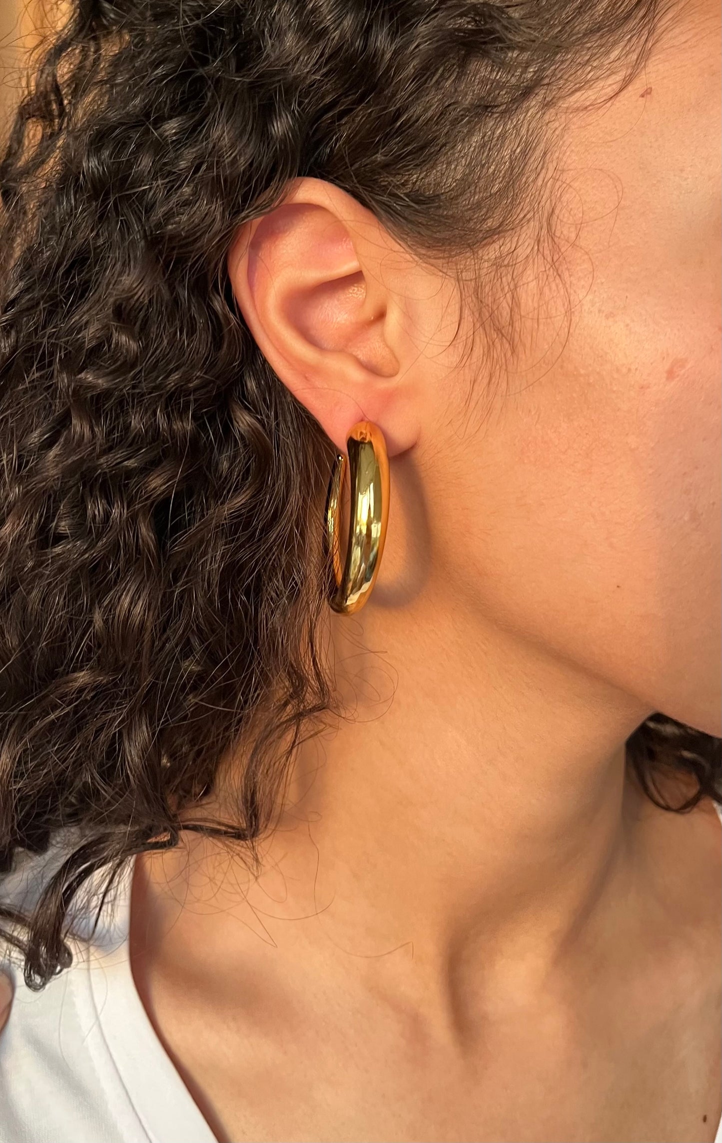 Large opened hoop earrings