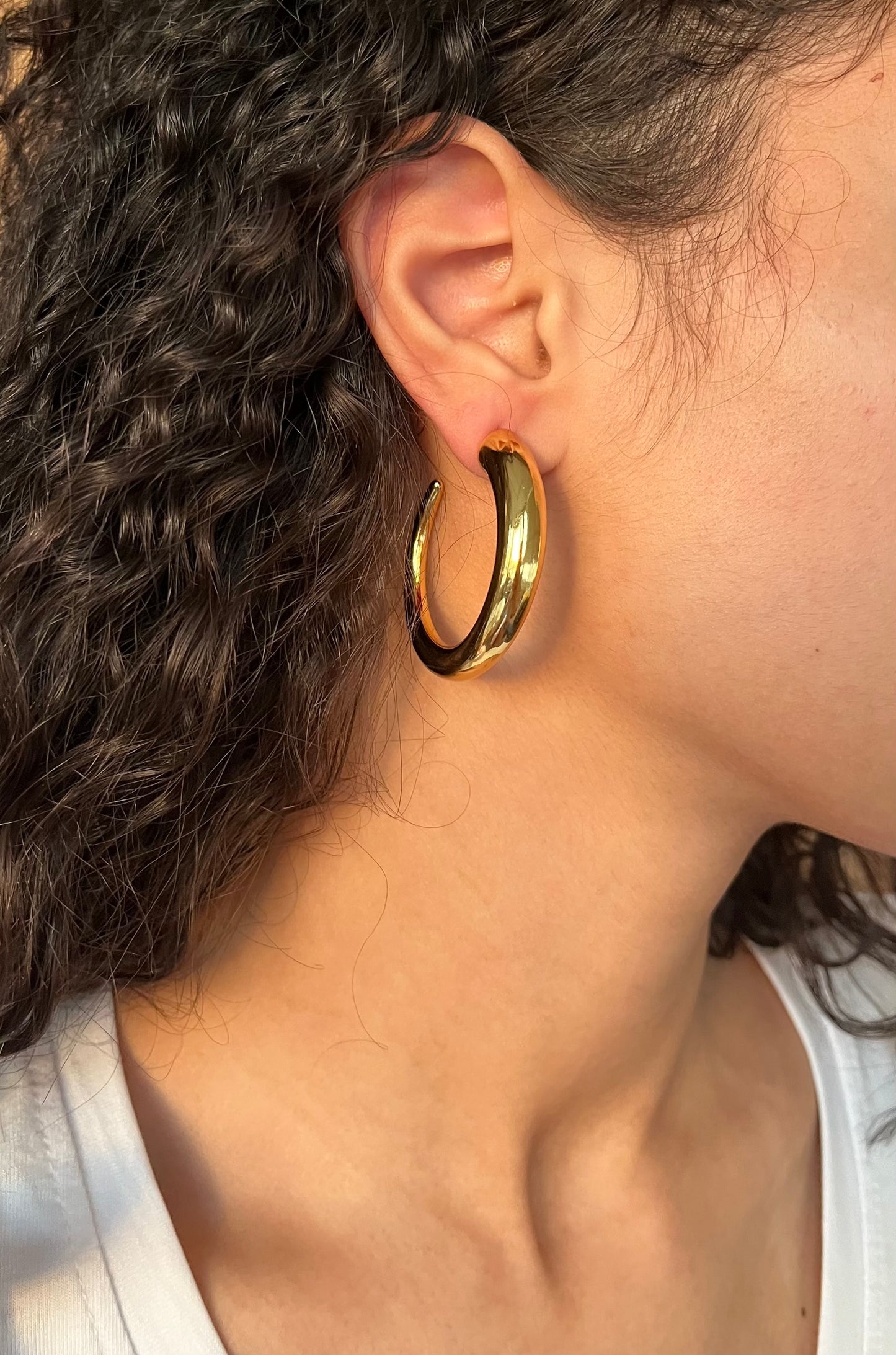 Large opened hoop earrings