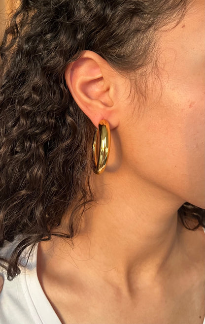 Large opened hoop earrings